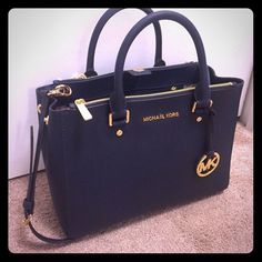 Michael Kors Sutton New with tags Michael Kors sutton medium bag. Bag is navy with gold accents. Has carry and shoulder straps. Just purchased at a Macys store closing and cant return but changed my mind. Comes with dust bag. No trades. Michael Kors Bags Simon Le Bon, Michael Kors Handbag, Cheap Michael Kors, Authentic Designer Handbags