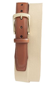 Contrast topstitching and a polished brass buckle add style to a striking surcingle belt that pairs ribbed canvas with supple calfskin leather tabs. Style Name:Torino European Surcingle Belt. Style Number: 5165937. Available in stores. Classic Fitted Leather Belts And Suspenders, Classic Beige Leather Belt, Classic Beige Belts For Formal Occasions, Classic Beige Belts For Formal Wear, Fitted Leather Belts And Suspenders, Fitted Leather Belts And Suspenders For Work, Casual Leather Belts And Suspenders, Classic Leather Belt With Leather Trim, Casual Fitted Leather Belt