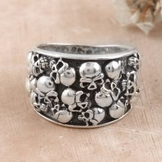 Spooky but dapper, this sterling silver domed ring is an eerie creation by designer Shivani Choudhary from India. Artisans of the region handcraft every detail with dedication, making skulls around the band for a unique look. Ring Boy, Om Pendant, Lion Pendant, Sterling Silver Mens, Domed Ring, Beaded Rings, Underworld, Jewelry Packaging, Jewelry Gift Box