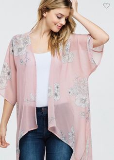 Perfect Women's Feeling Romantic Pink Floral Kimono for the Spring and summer months. Fabric is a lightweight poly chiffon that's see through and has a white floral all over print on a pink background. It has side slits and the front length is slightly shorter than the back length. This kimono is perfect for the woman on the go. Loose enough to tie a knot in the front if you want to. Very versatile and adds color and style to any wardrobe. Instantly transforms a basic jeans, leggings, shorts or Casual Printed Spring Cardigan, Casual Spring Printed Cardigan, Printed Beach Cardigan For Spring, Printed Beach Cardigan, Bohemian Short Sleeve Spring Outerwear, Casual Floral Print Open Front Cardigan, Spring Casual Cardigan With Kimono Sleeves, Casual Spring Cardigan With Kimono Sleeves, Casual Open Front Floral Print Cardigan