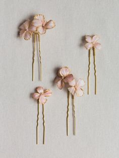 The Florence Hair Pin Set is a dash of sweetness for your tresses. Varying shapes and sizes of ruffled flowers with layers of blush and rose colors are applied by hand accented with golden edges and Swarovski pearl centers for the ultimate finishing touch. Wear using one, two, or all of the pins. Versatile styling ensures these will become a wardrobe staple whenever you want a little something extra in your hair. All flowers are created by hand, sculpted in our studio. Shipping and Production Garden Outfit, Printable Self Care, Rose Colors, Self Care Checklist, Streamer Dr, Flower Hair Pins, Floral Hair Pins, Gardening Outfit, Flower Hair Pin