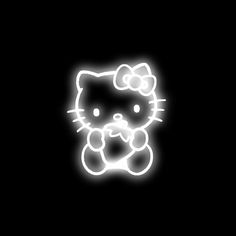 a neon hello kitty wallpaper in the dark with a white cat on it's face