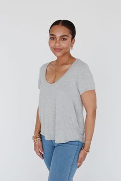 This Scoop Neck Bralette Tee is just the top you need to wear with trendy bralettes as this deep neckline is designed to flatter. The fabric is soft, the fit is straight, and the curved hemline is slightly longer in back to give you just what you need to rock your bralettes with easy style. Model is 5’8" and wearing a size small. Approximate measurements are as follows: Small: Bust: 36 3/4", Length(F): 24", Length(B): 28 1/4, Sleeve Length: 7 1/2" Medium: Bust: 38 3/4", Length(F): 24 1/2", Lengt Cute Bralettes, Bell Bottom Jeans Outfit, Lace Bras, Best Shirt, Neutral Tops, Slouchy Tee, Crochet Bralette, Bottom Jeans, Black Bralette