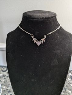 Angels are real, just like you! Embrace the Y2K vibe with this Angel Heart Necklace! This silver chain choker features a delicate heart pendant that is perfect for layering or as a statement piece on its own! Add a touch of heaven to your look ✨😇 Sizing is intended to be a loose choker style, but is adjustable by 3-4 inches! Small customizations (such as length) can be done easily as all pieces are made by me! Just send me a message and I'll do my best to accommodate your request! Metal Heart Charm Choker Necklace, Y2k Style Clavicle Chain Necklace, Heart Charm Y2k Jewelry For Gifts, Silver Heart Choker Necklace With Chain, Gothic Clavicle Chain Necklace With Heart Pendant, Y2k Style Heart Charm Jewelry Gift, Valentine's Day Choker Chain Necklace, Silver Metal Heart Choker Necklace, Y2k Style Necklace With Adjustable Chain As A Gift