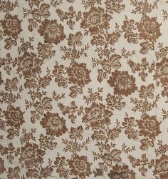 a brown and white flowered wallpaper with small flowers on it's side