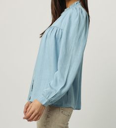 Long sleeve shirt button down style with ruffle finish at the neckline. Adored styling with relaxing fit. Always garnering the second looks! Solid color woven on relaxed fit.Body length from HPS: 26",Sleeve length: 25 1/2", Bust: 44" (Size Small) 100% TENCEL Machine wash cold,Tumble dry low Imported Button Down Style, Fit Body, Shirt Button, Long Sleeve Top, Long Sleeve Shirt, Button Downs, Sleeve Shirt, Long Sleeve Tops, Sleeve Top