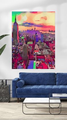 a living room with a blue couch and a painting on the wall above it that has a cityscape