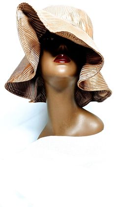 This hat is made reversible and able to be worn in many different styles. It's easy to pack and take with you when traveling. Brown Sun Hat With Short Brim, One Size, Brown Wide Brim Cloche Hat For Spring, Brown Curved Brim Straw Hat One Size, Chic Curved Brim Hat One Size, Chic One Size Hat With Curved Brim, Reversible Wide Brim Bucket Hat One Size, Chic Curved Brim Hat, Brown Wide Brim Straw Hat One Size, Chic Adjustable Brown Cloche Hat