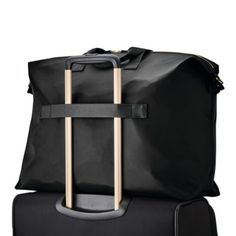 Samsonite Mobile Solutions Classic Duffel Bag Elegant Black Duffle Bag For Weekend Trips, Chic Black Weekender Bag With Luggage Sleeve, Elegant Black Weekender Bag For Weekend Trips, Elegant Black Weekender Bag For Trips, Elegant Black Bags For Weekend Trips, Elegant Black Travel Bag For Weekend Trips, Chic Black Travel Bag With Zipper, Elegant Black Travel Bag, Black Travel Bag With Adjustable Strap For Shopping