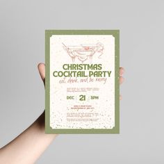 a person holding up a christmas cocktail party flyer