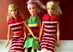 three barbie dolls are dressed in colorful clothes