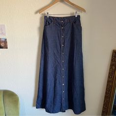 - 1970’s Era Blue Denim Dress By Levi’s! - Full Functional Button Down Front - High Waisted, Long Style - Excellent Condition, Just Missing Back Pocket Tab - Comes From A Smoke Free Home - 1-2 Day Shipping! Approximate Measurements Flat Across: Waist- 13.5” Length- 39” Vintage Blue Denim Skirt, Vintage Medium Wash Skirt With Pockets, Vintage Cotton Skirt In Dark Wash, Vintage Long Denim Skirt For Spring, Vintage Dark Wash Bottoms With Buttons, Vintage Denim Skirt With Pockets, Vintage High-rise Skirt With Pockets, Vintage High Rise Denim Blue Skirt, Vintage Dark Wash Denim Skirt