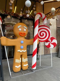 two giant candy canes and a gingerbread man