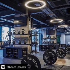 an open gym with rows of weight machines