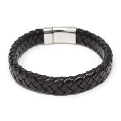 This seven-inch bracelet features a black braided leather band with a silver toned captains ship anchor clasp Casual Adjustable Braided Bracelet With Stainless Steel Clasp, Adjustable Casual Braided Bracelet With Stainless Steel Clasp, Everyday Black Braided Bracelet With Leather Strap, Everyday Black Leather Braided Bracelet, Classic Black Braided Bracelets, Classic Black Braided Bracelets For Everyday, Adjustable Black Leather Bracelet With Stainless Steel Clasp, Classic Adjustable Braided Bracelet With Lobster Clasp, Black Braided Bracelets With Stainless Steel Clasp As Gift