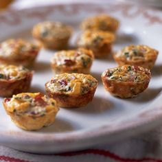 several small muffins on a white plate