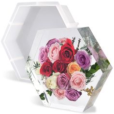 an acrylic box with flowers painted on it