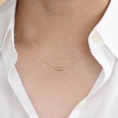 14K Gold Dainty Beads Necklace. 14K gold delicate necklace. 14K gold small beads necklace. The necklace will be shipped in a gift box. ★ 14K yellow gold bead is 3mmx 1.5mm. ★ The necklace is 14K yellow gold 1.2mm flat cable chain. Please read our policies before you place your order. https://www.etsy.com/shop/SashJewelry/policy?ref=shopinfo_policies_leftnav To see other Mother daughter necklace set click here: https://www.etsy.com/shop/SashJewelry?section_id=12441134&ref=shopsection_leftnav_ Dainty Yellow Gold Beaded Necklace Gift, 14k Yellow Gold Necklace With Tiny Beads, Dainty 14k Gold-filled Beaded Necklaces, Delicate 14k Gold-filled Necklace With Tiny Beads, Tiny Delicate 14k Gold-filled Necklaces, Small Beads Necklace, Mother Daughter Necklaces Set, Other Mother, Mother Daughter Necklace