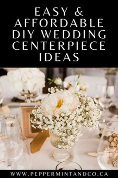 an image of a table setting with flowers in vases and wine glasses on it