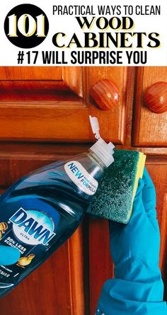 someone cleaning their kitchen cabinets with the words, 10 practical ways to clean wood cabinets