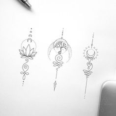 three different designs on a piece of paper next to a pen and ink drawing supplies