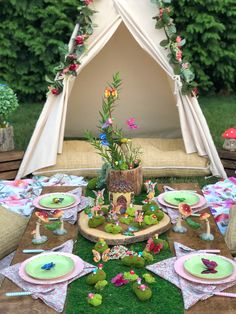 a table set up for a fairy garden party