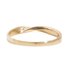 a yellow gold wedding ring with curved edges and an irregular design on the top,