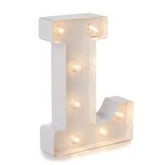 a white light up letter with lights on it