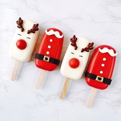 four pops decorated like santa claus and reindeer faces