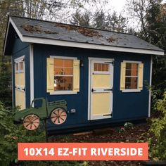 a small blue and yellow shed with the words 10x14 ez - fit riverside