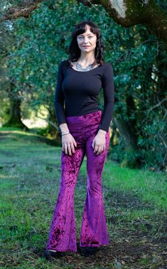 The Slim Bell Pants are the go to every day pant aka "the yoga pants." These puppies should be in constant rotation in your closet. We have taken our Flow Pant and toned it down on the flare and turned it up on the fit from hip to knee. Design Features: Wider waist band hits just under belly button Low rise center seam Hugs hips and legs to knee Slight flare at knee Great for every day, dance, movement, hooping and yoga Made in San Francisco, CA, USA Fabric Features: Rich boysenberry soft crush Fall Yoga Trousers, Yoga Trousers For Fall, Fitted Bottoms For Yoga In Fall, Fitted Yoga Bottoms For Fall, Purple Stretch Bottoms For Fall, Stretch Yoga Pants For Fall, Fitted Wide Leg Purple Bottoms, Fitted Purple Wide Leg Casual Pants, Fitted Straight Leg Yoga Pants For Fall