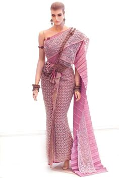 a woman in a pink sari and headpiece