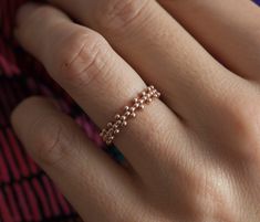 Simple beaded crown ring in 14k gold. This ring is designed for those who love simplicity with a slight of twist. This ring is perfect as a simple wedding band for her. Ring on the picture is polished. Also matte style is possible. If you would like to have matte band please leave a note at the checkout. Width of the band is 3.80mm and the thickness of it is 1.50mm. Open spaces between the millgrains measure 1.60mm Gemstones can be set in this band. Pleae contact me for pricing. Sizes available: Simple Wedding Band, Rings Pearl, Beaded Crown, Diy Beaded Rings, Bracelet Miyuki, Beads Craft Jewelry, Ring Rosegold, Her Ring, Miyuki Bracelet