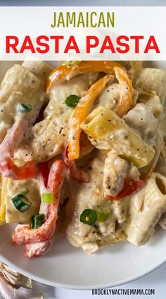 a white plate topped with pasta covered in sauce