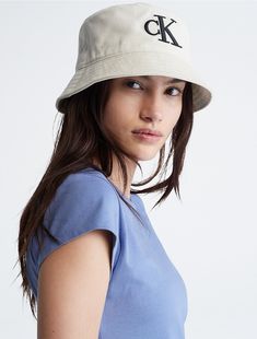 Crafted with cotton twill, this bucket hat features an embroidered monogram logo at center front. Fully lined, this hat is finished with a sloped brim and topstitching accents.  Material: 100% Cotton. Spring Cotton Hat With Logo Patch, Casual Brimmed Canvas Bucket Hat, Casual Wide Brim Cotton Bucket Hat, Adjustable Cotton Hat With Logo, Summer Wide Brim Hat With Embroidered Logo, Flat Brim Hats With Embroidered Logo For Summer, Canvas Hats With Embroidered Logo And Curved Brim, Canvas Hat With Embroidered Logo And Curved Brim, Casual Cotton Bucket Hat With Curved Brim