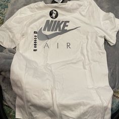 Nike Mens White Reflective Tee Nike White Cotton Shirt, Nike Cotton Top, Nike Cotton Tops With Branding, Urban White Crew Neck Top, Urban White Shirt With Logo Print, Urban White Tops With Logo Print, Nike Urban Sports Tops, Casual White Shirt With Branding, Nike Urban Tops With Letter Print