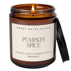 a pumpkin spice candle sitting on top of a table