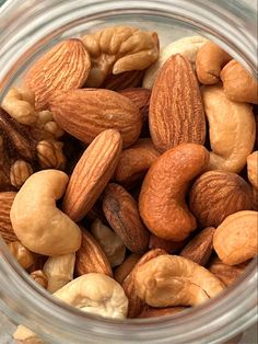 a jar filled with nuts sitting on top of a table