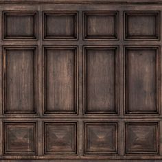 an old wooden paneled wall with square and rectangle design