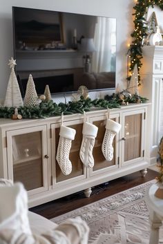 Christmas Cabinet Top Decor, Christmas Stockings Apartment, New Year Living Room Decor, Holiday Decor For Small Apartment, Tv Console Christmas Decor Garland, Cute Christmas Decoration, Decorating My House For Christmas, Christmas Console Table Decor Under Tv, Christmas Asthetics Decor