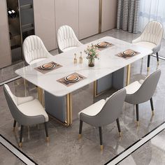 a dining room table with chairs around it