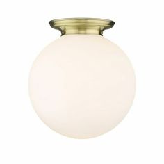 a light fixture with a white glass ball on the top and gold trimmings