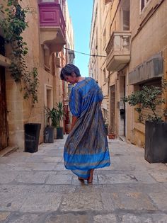 Gorgeous upcycled maxi dress in blue and gold! Repurposed from a vintage saree into this floaty garment which moves like liquid and is perfect for wafting about in. Handmade by me, a self-taught dressmaker based in Malta. Please feel free to reach out and say hi :) Blue Floor-length Maxi Dress For Festival, Flowy Blue Traditional Maxi Dress, Traditional Flowy Blue Maxi Dress, Traditional Blue Flowy Maxi Dress, Bohemian Blue Silk Maxi Dress, Blue Silk Bohemian Maxi Dress, Blue Silk Festive Maxi Dress, Festive Bohemian Maxi Dress For Festivals, Blue Traditional Maxi Dress For Festival