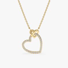 Celebrate the enduring power of love with this captivating Interlocking Heart Diamond Necklace. This exquisite piece features two interlocking heart-shaped pendants, crafted from solid 14k gold (available in yellow, white, or rose gold). One heart shimmers with sparkling diamonds, adding a touch of brilliance and everlasting love, nestled in the embrace of a smaller, smooth gold heart. - Handmade - Solid Gold - Natural Diamonds  - G Color, SI Quality Diamonds - Total Diamond Carat Weight: 0.15 ctw - Pendant Size: 12 mm x 14 mm 🛠 Your Sarah Elise piece is handcrafted with care! Ready-to-ship items go out within 3 business days. Made-to-order pieces typically take 7-10 business days to create. If you need something sooner, please contact us - we'll see if we can make it happen! For estimate Elegant Heart Pendant Necklace With Cable Chain, Elegant Heart-shaped Cable Chain Jewelry, Elegant Cable Chain Jewelry For Valentine's Day, Elegant Sterling Silver Heart Necklace With Cable Chain, Heart Necklace With Cable Chain For Anniversary, Anniversary Heart Necklace With Cable Chain, Heart-shaped Cable Chain Necklace For Anniversary, Heart Shaped Cable Chain Necklace For Anniversary, Elegant Heart Necklace With Cable Chain For Valentine's Day