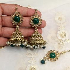 *Light Weight dark gold Adjustable necklace set with earrings and tikka.*Studded with crystal stone.*Light Weight Gold necklace.*Necklace width- 1.4 inches (included pearl drop)*Earrings Length- 2.7 inches(included pearl drop)*Dome size-  1 inches Gold Plated Kundan Necklace With Latkans For Wedding, Kundan Jewelry Sets With Latkans For Eid, Gold Plated Stone Work Jhumkas For Wedding, Gold Plated Jhumkas With Stone Work For Wedding, Bollywood Kundan Jewelry Sets With Latkans, Gold Tikka With Matching Earrings For Festive Occasions, Festive Gold Tikka With Matching Earrings, Bollywood Style Gold Plated Jewelry Sets With Stone Work, Bollywood Style Jewelry Sets With Matching Earrings