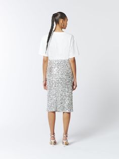 Turn up the sparkle with this stunning midi skirt. Adorned with shimmering silver sequins and embellished further with clusters of 3D paillette flowers, this skirt adds beautiful dimension and captivating elegance.  Hand-embroidered paillettes  Midi-Length  Fits true to size, take your normal size. Model is 5'9" / 174cm and wears a size UK6 (US2 / EU34) Main: 100% Polyester Lining: 95% Polyester 5% Elastane  Dry Clean Only Turn inside out before cleaning Do not tumble dry Iron on low heat, maxim June Birthstone Jewelry, Gifts For New Mums, Jewelry Ring Box, Pearl Jewellery Earrings, Silver Sequin, Turn Up, June Birth Stone, Independent Designers Fashion, Gifts For New Moms