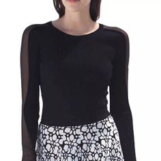 A Sleek Long-Sleeved Cropped Top With A Hint Of Flare. The Sheer Panel Down The Arm Brings A Sophisticated Edge To The Arkane Cropped Top. Layer With The Corresponding Yves Pencil Skirt Or A Printed Midi Skirt. Size Small Bust Width: 10" Sleeve Length: 18 1/4" Waist: 8 1/2" Length: 18" Shell: 65% Viscose, 35% Nylon Contrast: 100% Silk Care Instructions: Professional Dry Clean Only Listed For $299 On Website Nordstrom Bloomingdales Neimann Marcus Saks Fifth Avenue Macy's Luxury Chic Crew Neck Mesh Top For Night Out, Chic Mesh Top With Crew Neck And Mesh Sleeves, Casual Fitted Blouse With Mesh Sleeves, Chic Fitted Long Sleeve Mesh Top, Black Blouse With Mesh Sleeves For Spring, Long Sleeve Mesh Top For Work, Chic Fitted Mesh Top For Workwear, Elegant Crew Neck Mesh Top For Spring, Elegant Crew Neck Top With Mesh Sleeves