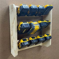 dewalt battery storage rack idea made from plywood to store dewalt 20v batteries made from plywood with cnc router project files Dewalt Tool Storage Organizers, Dewalt Battery Charging Station, Cordless Battery Storage, Dewalt Battery Storage, Tool Battery Storage, Dewalt Tool Storage, Cleat Wall, Dewalt Battery, Battery Charging Station