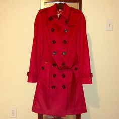 Nwt Burberry Sandringham Cashmere Trench Coat In Parade Red, Size Us 4. The Sandringham Is A Slim Fit Style (It Has Been Replaced By The Chelsea) So It Is More Tapered Along The Waist And Shoulders. Guaranteed Authentic And Poshmark Will Authenticate For Free! Fits True To Size. 100% Cashmere Black Buttons Check Lining Under The Collar Burberry Cashmere Trench Coats Retail For $2990 Plus Tax. Definitely An Investment But Burberry Coats Will Last For Years And Still Look Gorgeous! Luxury Red Double-breasted Outerwear, Elegant Red Wool Outerwear, Luxury Red Fall Outerwear, Designer Red Long Sleeve Outerwear, Short Trench Coat, Leather Coat Jacket, Grey Trench Coat, Burberry Coat, Burberry Trench Coat