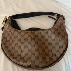 Brand New Gucci Bag That I Had Stored Away Looking To Sell It On The Sides It’s Got A Little Discoloration From Storage But It Was Never Use Brand New Brown Gucci Bag For Everyday Use, Gucci Brown Top Handle Shoulder Bag, Classic Brown Gucci Shoulder Bag, Gucci Brown Monogram Canvas Shoulder Bag, Gucci Brown Shoulder Bag With Detachable Handle, Brown Gucci Shoulder Bag With Detachable Handle, Gucci Brown Bag With Detachable Handle, Brown Gucci Bag With Detachable Handle, Luxury Brown Hobo Bag With Branded Hardware